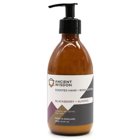A sleek amber glass bottle of ancient wisdom body lotion with black pump in blackberry and almond seed oil scent