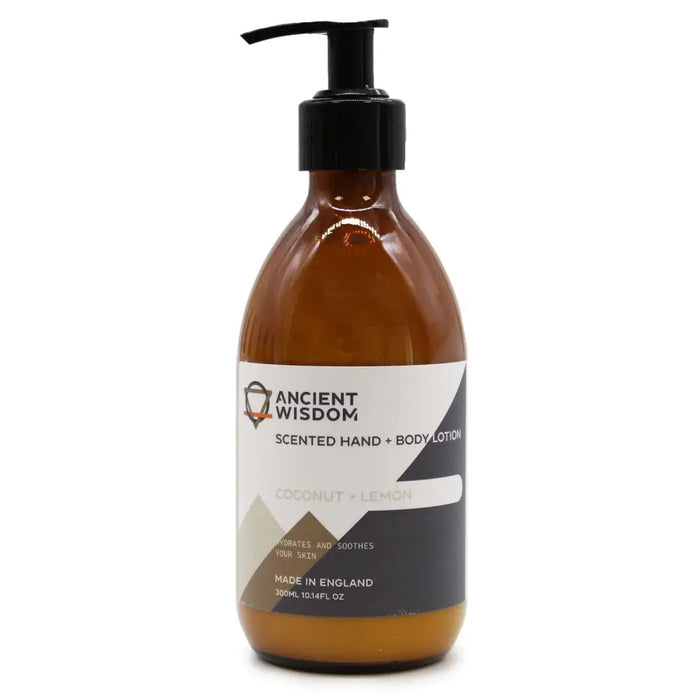 A sleek amber glass bottle with black pump body lotion scented with coconut lemon featuring seed oil