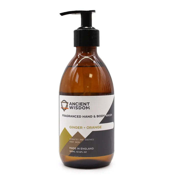 A sleek amber glass bottle of ancient wisdom ginger and orange body wash with a black pump dispenser 300ml