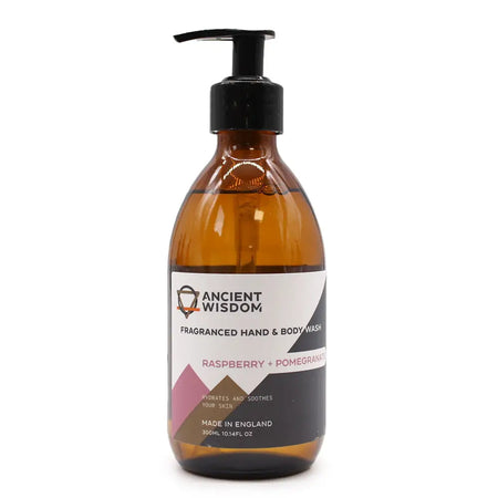A sleek amber glass bottle of hand and body wash with a black pump featuring a fruity raspberry and pomegranate scent