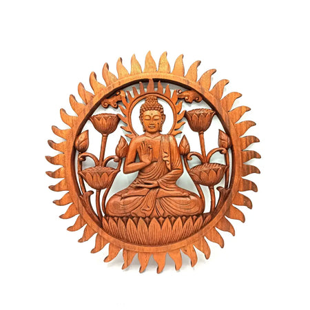 Hand carved wooden plaque showing a serene buddha with lotus flowers and sunburst rays in natural wood tones