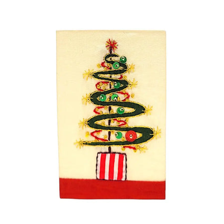 Hand-embroidered christmas card showing a green christmas tree with red and gold ornaments on an off-white background