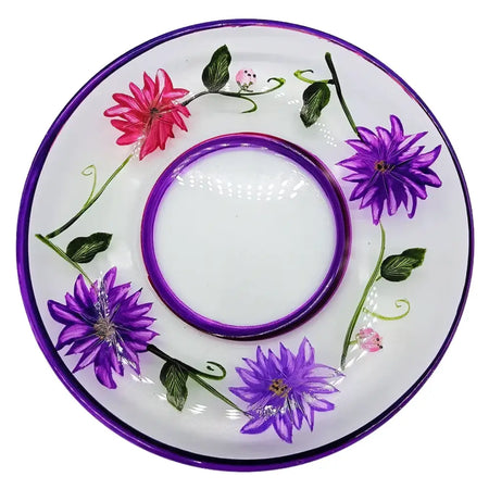 Hand-painted glass candle plate with purple wild flowers and green vines on a glossy purple rim saucer