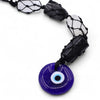 Hanging stone pendant with cobalt blue evil eye glass and black macrame cord with clear quartz and black tourmaline stones