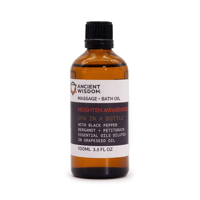 A 100ml amber glass bottle of heighten awareness massage oil with black pepper and bergamot in grapeseed oil