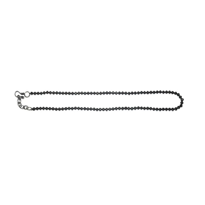 Hematite barrel beaded necklace with black beads and a silver toned clasp shown against a white background