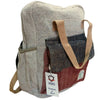 A handmade hemp adventure backpack in beige dark gray and rust red herringbone fabric with tan canvas straps