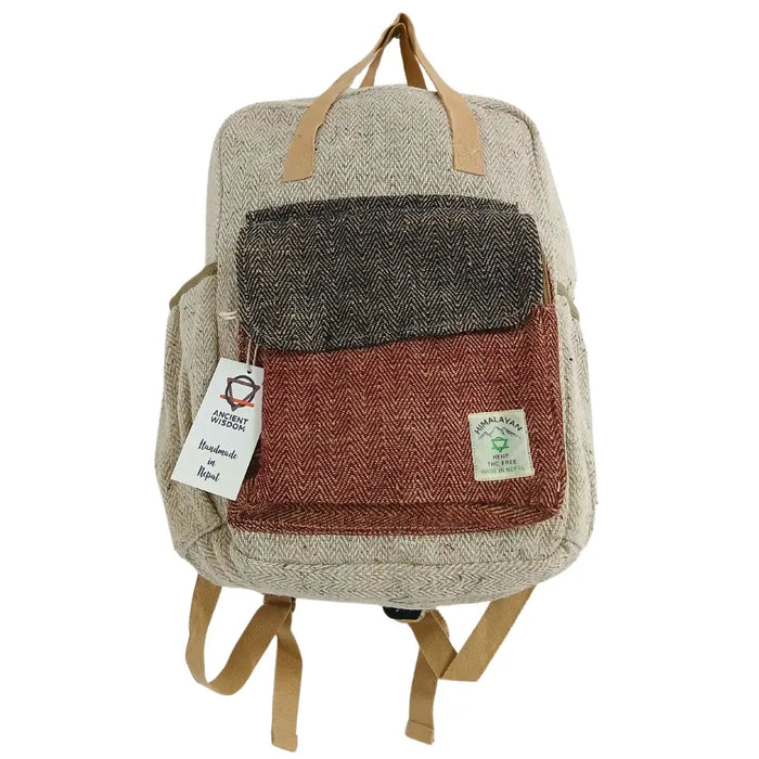 Hemp adventure backpack in earthy patchwork herringbone pattern with beige straps made from hemp materials