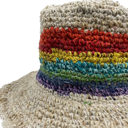 Hand-knitted cotton festival hat with natural beige brim and vibrant rainbow stripe pattern made from hemp and cotton