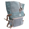 A hemp trekking rolling backpack in sage with teal and gray herringbone pattern and brown leather straps