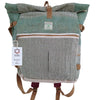 A teal and gray herringbone hemp trekking rolling backpack with brown leather accents and durable materials