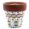 A herb garden candle geranium in a terracotta pot with yellow green and purple geometric pattern soy wax wooden wick