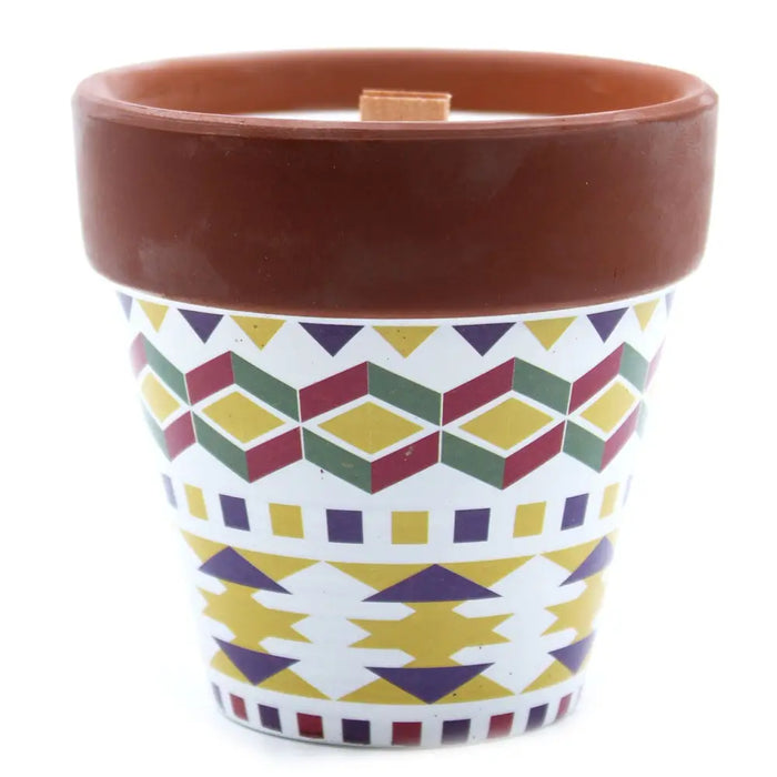 A herb garden candle geranium in a terracotta pot with yellow green and purple geometric pattern soy wax wooden wick