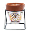 A terracotta herb garden candle with sage scent in a white ceramic pot with brown and gold geometric patterns made of soy wax