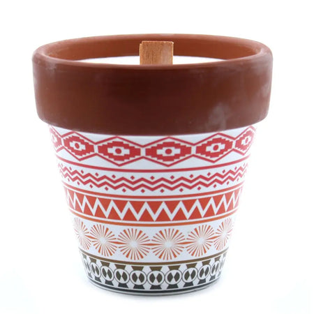 Terracotta pot candle with red white and black geometric patterns featuring soy wax mint herb garden scent
