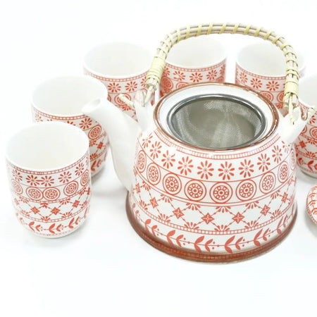 White ceramic teapot with red floral patterns and bamboo handle featuring stainless steel infuser herbal teapot set amber