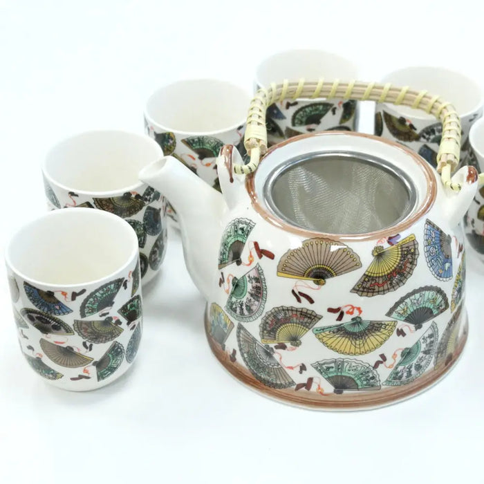 White ceramic teapot with woven bamboo handle and green yellow brown fan pattern from herbal teapot set chinese fans