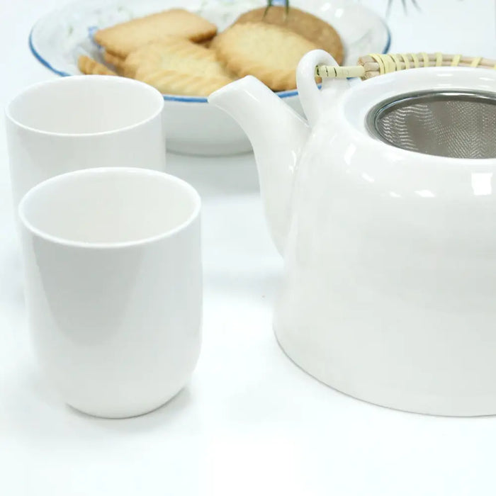 White ceramic teapot with stainless steel infuser and bamboo handle from the herbal teapot set classic white
