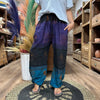 Purple and teal high cross yoga festival harem pants with intricate embroidered Himalayan print patterns