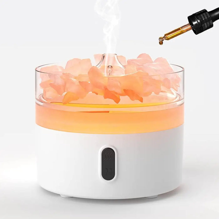 White cylindrical himalayan salt aroma diffuser with pink rose petals glowing orange liquid and black control panel