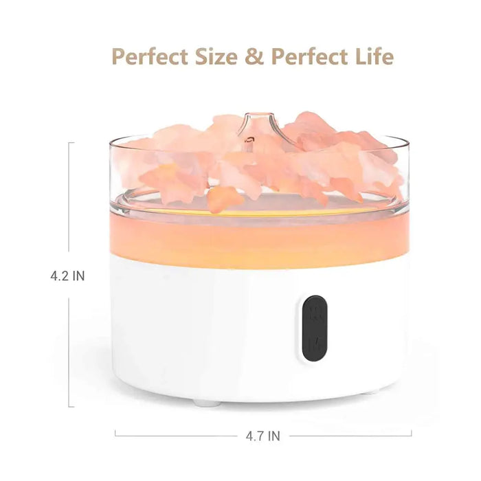 White and orange cylindrical aroma diffuser with clear glass top filled with pink himalayan salt crystals and flame effect