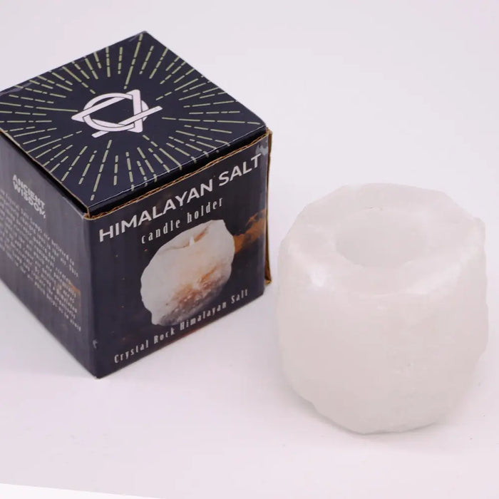 A translucent white himalayan salt crystal rock tealight holder with a rounded, natural crystalline texture