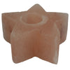 A pink himalayan salt star-shaped tealight holder with a central circular opening for candles