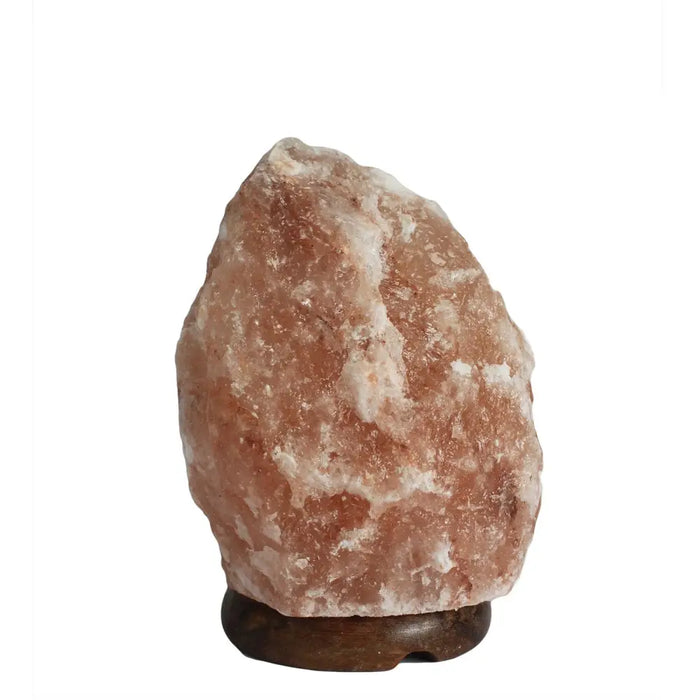 A rustic pink himalayan salt lamp with rough texture and white crystals on a dark wooden base weighing 1.5-2kg