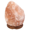 A pink himalayan salt lamp weighing 3-5kg with a rough crystalline texture and natural mineral facets