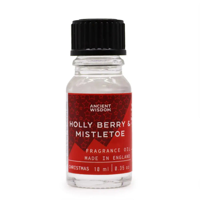 A clear glass bottle with black cap and red label of Ancient Wisdom holly berry and mistletoe fragrance oil 10ml with allergen declarations