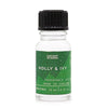 A clear glass bottle with black cap and green label of ancient wisdom holly and ivy fragrance oil 10ml made in england