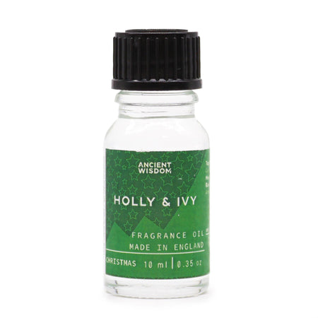 A clear glass bottle with black cap and green label of ancient wisdom holly and ivy fragrance oil 10ml made in england