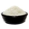 A mound of coarse white simmering granules in a dark brown ceramic bowl from home comforts hallway blend