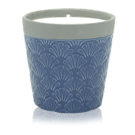 Blue ceramic candle pot with textured fan pattern gray rim filled with soy wax from home is home blue day collection