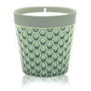A sage green ceramic Home is Home candle pot with textured honeycomb pattern and light gray rim for soy wax fruit basket