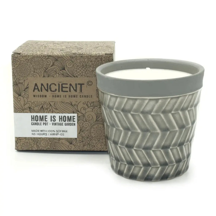 Gray ceramic candle pot with textured chevron pattern and white soy wax candle in vintage garden scent