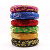 Stack of six colorful embroidered hoop cushions 16cm with golden patterns on satin fabric for 18 20cm singing bowls