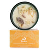 A hop hare crystal magic flower candle in a dark green container with white floral wax dried flowers and rock quartz