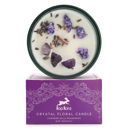 A hop hare crystal magic flower candle in dark green tin with lavender scent dried purple flowers and amethyst crystals