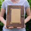 Brown leather-bound customisable visitor book with floral embossing and brass clasp 13x10 inches