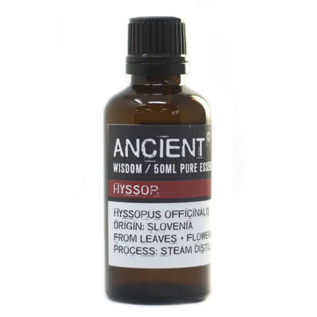 A dark amber glass bottle of hyssop essential oil 50ml with a black cap and label showing allergen declarations and steam distillation