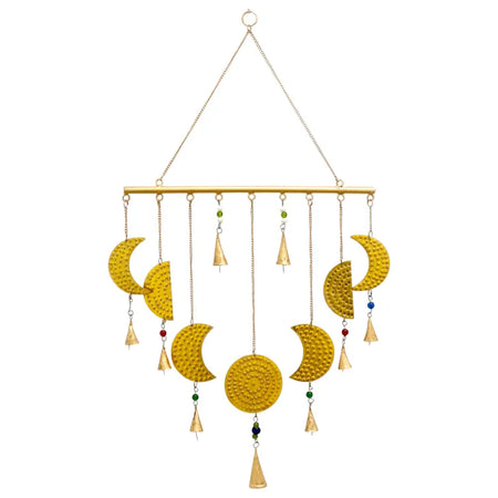 Brass indian chimes with golden crescent moon phases textured metal and colorful gemstones with dangling bells