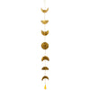 Golden brass moon phases wall hanging with hammered texture and small yellow tassel at the bottom with a bell