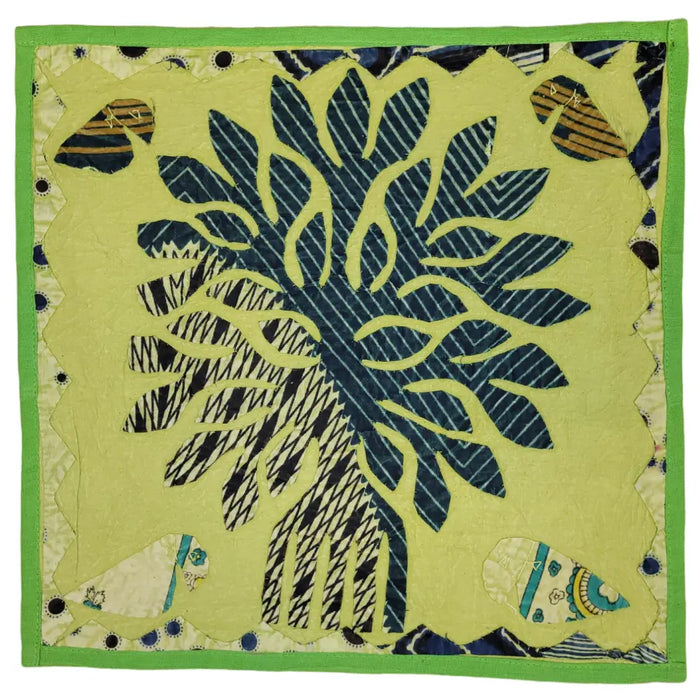 Indian patchwork cushion cover with vibrant lime green and navy blue fabric featuring a central floral design