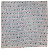 A light blue indian patchwork cushion cover with pink watermelon slices and black silhouette patterns
