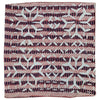 A square indian patchwork cushion cover with deep red and navy bands and white starburst motifs called prayer of zion