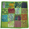 Indian patchwork cushion cover with vibrant embroidered and printed squares in maroon teal gold olive and bold green border