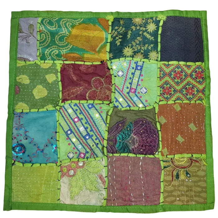 Indian patchwork cushion cover with vibrant embroidered and printed squares in maroon teal gold olive and bold green border