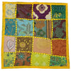 Vibrant indian patchwork cushion cover with bold yellow border featuring floral paisley and geometric fabric squares