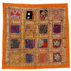 Vibrant orange-bordered indian sari tile standard cushion cover with colorful embroidered fabric squares in reds and blues